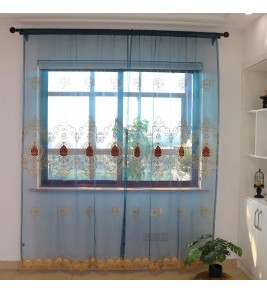 Light blue tulle curtains with golden hollow patterns