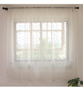 White tulle curtains with tree branch embroidery